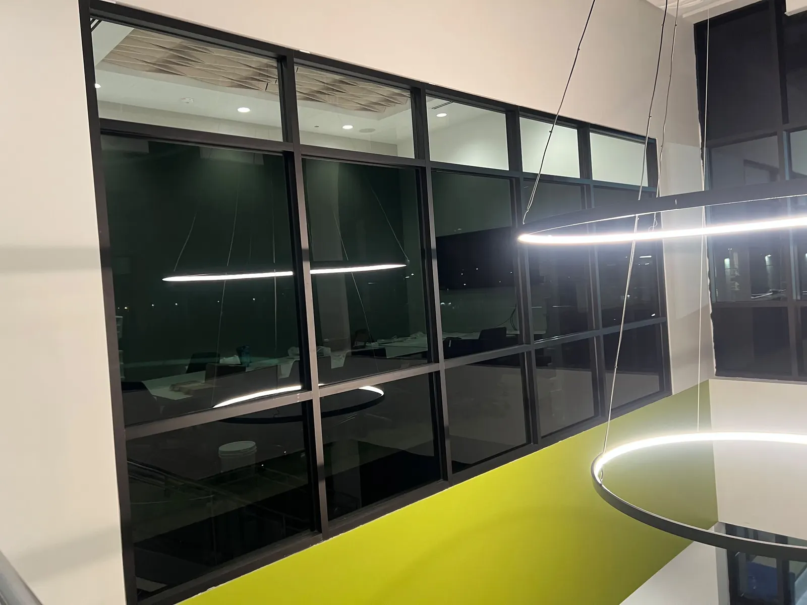 Dark tinted film on interior glass partitions