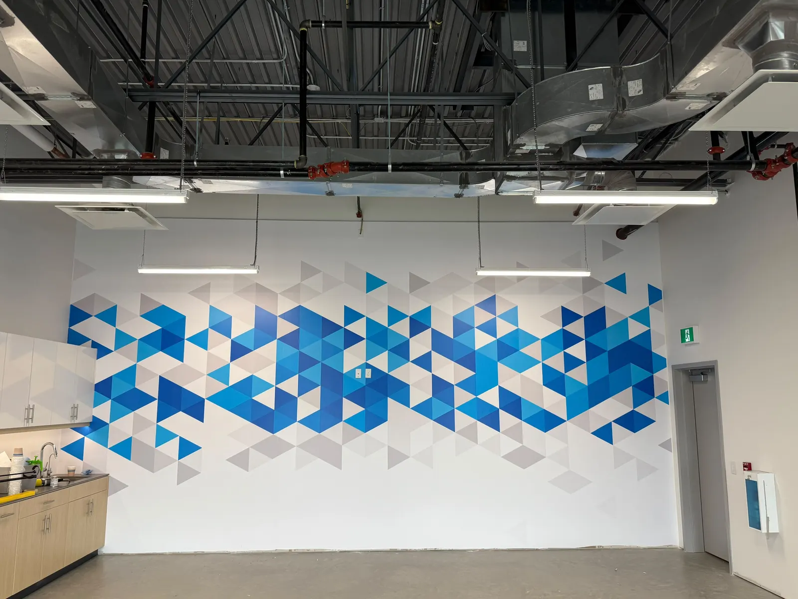 Printed and cut triangle mosaic wall graphic