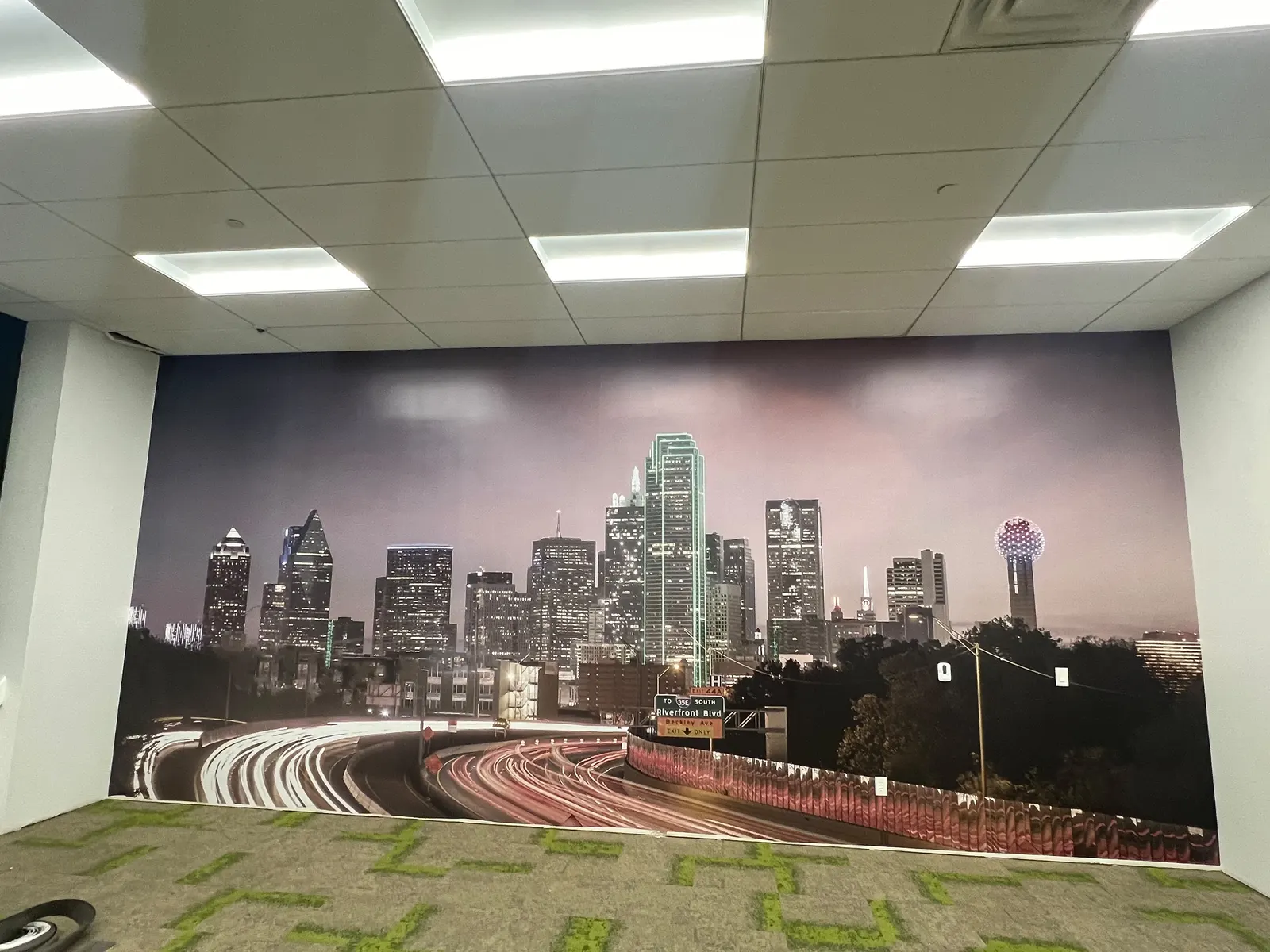 Printed city skyline wall mural in an office