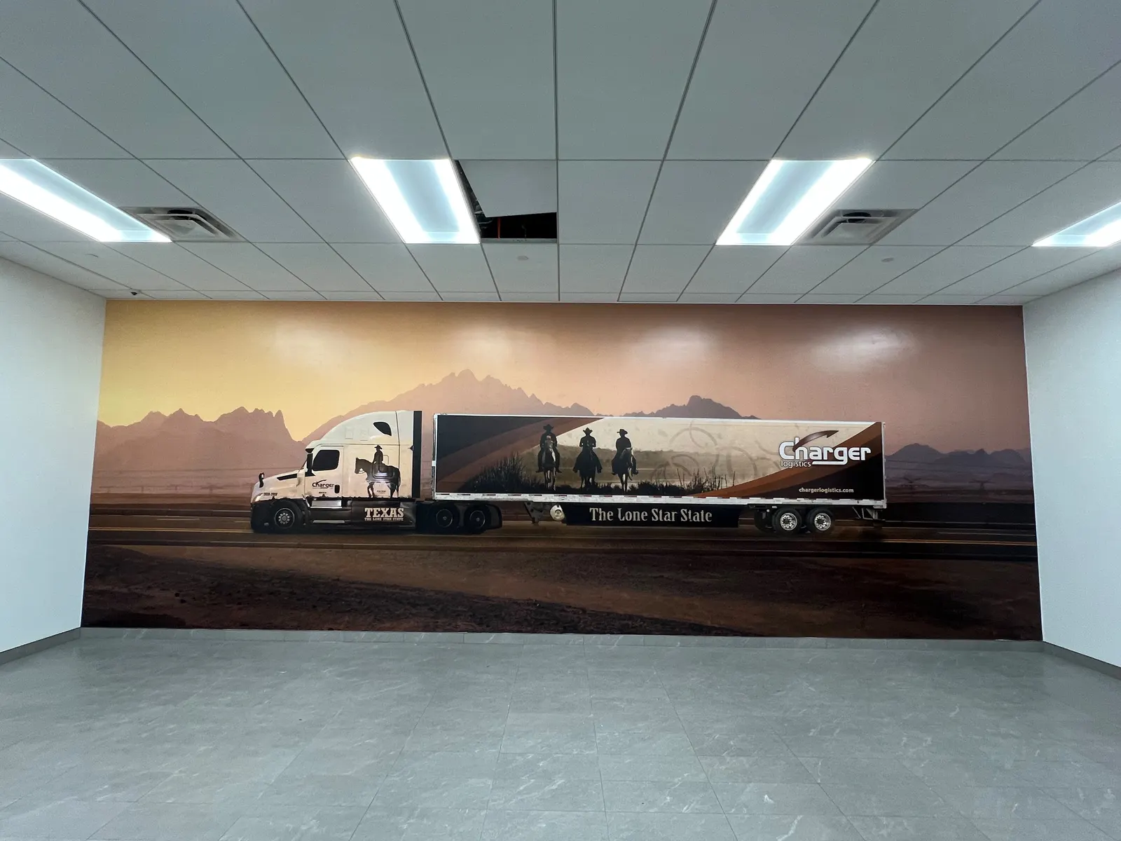 Printed wall mural of a truck crossing the desert